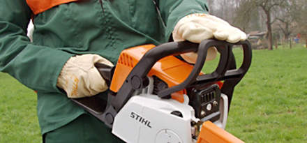 : Step 1 of 15: Before starting your chainsaw, the chain brake should be activated by pushing it forward (see picture).