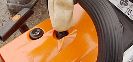: Step 3 of 15: If your chainsaw is fitted with a decompression valve, press it now. It assists with firing the engine and starting your chainsaw.